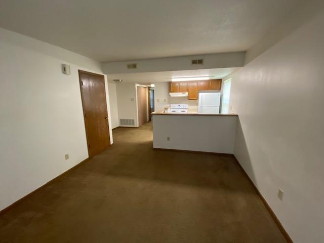 Living room looking to kitchen similar unit - 7336 Hampton Ave