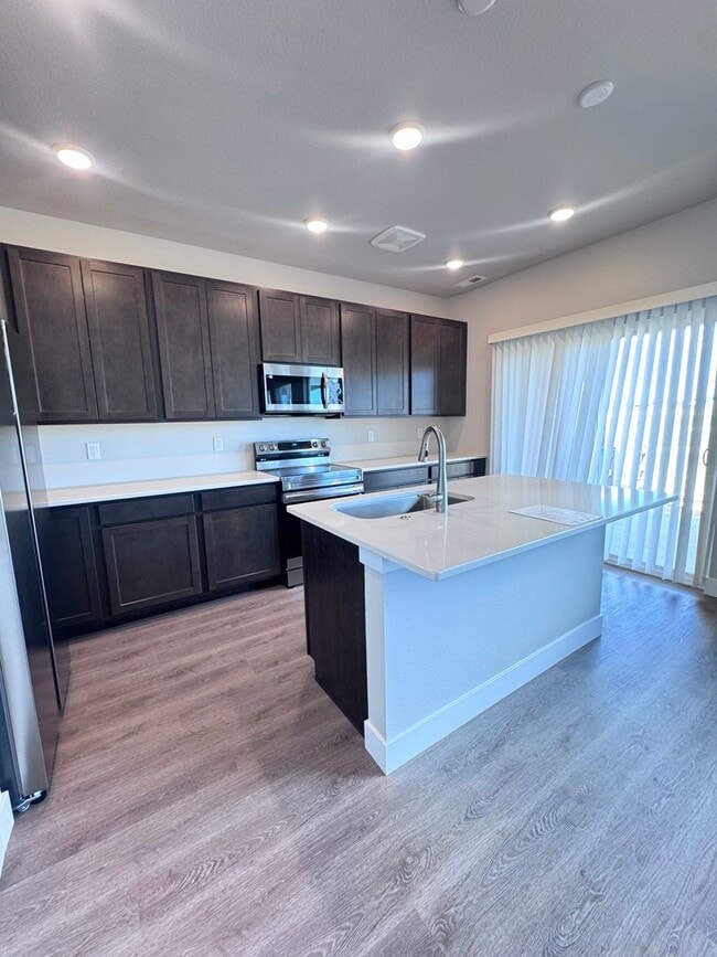 Building Photo - Sage Meadows II Townhomes — Lakeside Living Meets Modern Comfort!