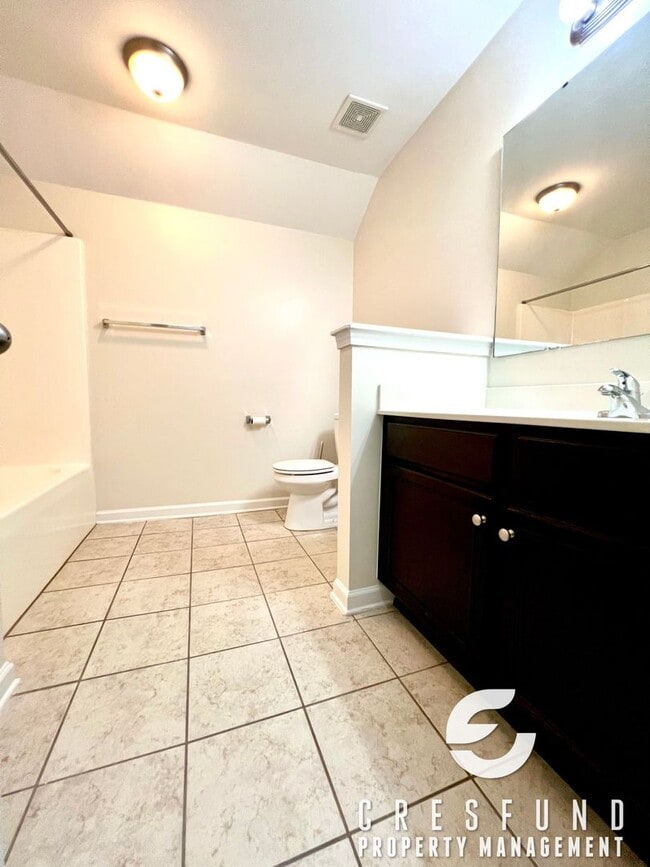 Building Photo - Freshly Painted and Spacious 4 Bedroom, 3 ...