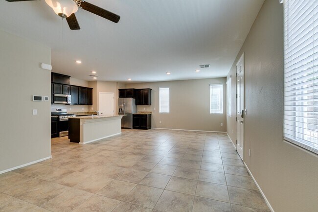 Building Photo - Spacious Townhouse with Loft & Rare 3-Car Garage!