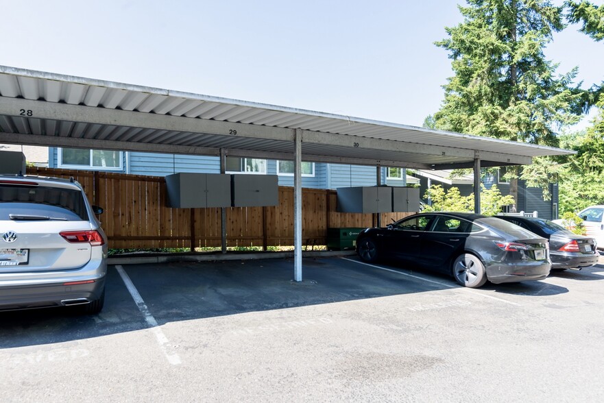 View of the one dedicated covered carport parking space (#29) with built in storage cabinet - 9350 Redmond Woodinville Rd NE