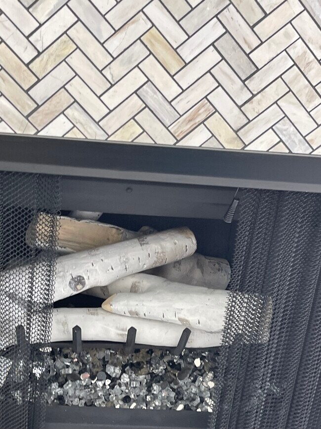 Birch wood fire-glass fireplace floor-to-ceiling Herringbone tile - 811 Spindrift Dr