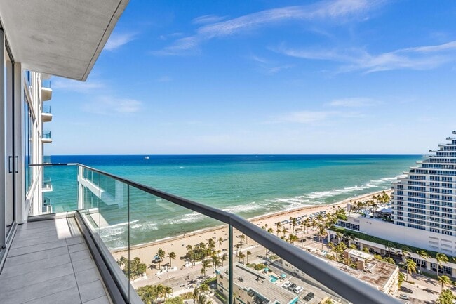 Building Photo - Stunning High-Rise Condo with Ocean Views | Prime Beach Location