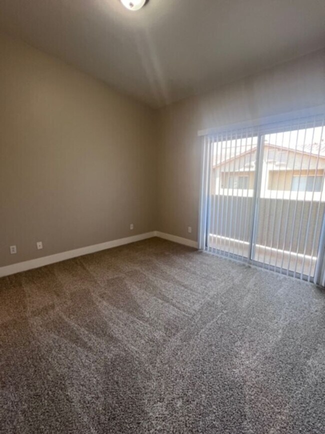 Building Photo - Three bedroom townhouse with 2 car garage