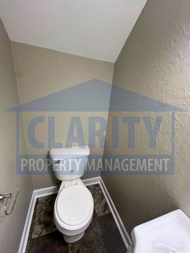 Building Photo - Charming three-bedroom home with carport!