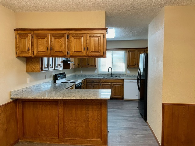 Large kitchen with lots of cabinets and new granite countertops! - 100 Village Oaks Dr