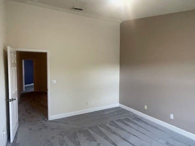 Building Photo - Stunning townhome in gated community near ...