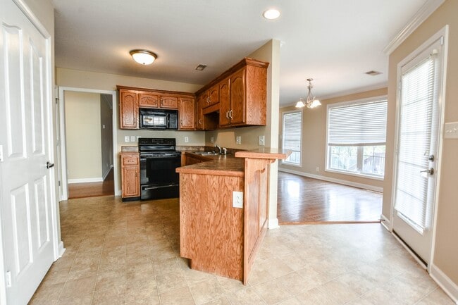 Building Photo - Pet Friendly Three Bedroom with Bonus!