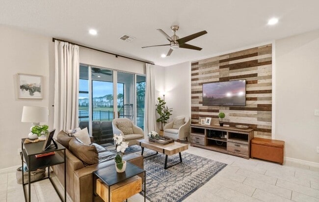 Building Photo - Water Front Home- 4 Large Bedrooms-3 baths Gated Community Call Sheila Campbell 407-687-7900
