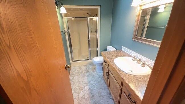 Building Photo - 4bd/3ba HUGE Home w/Hardwood Floors, Russian Fireplace, 2-Car Garage & Fenced Back Yard!