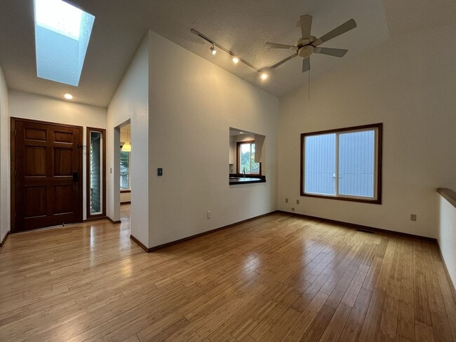 Building Photo - Spacious 3-Bedroom Home with Custom Stone Fireplace, Attached 2-Car Garage & Expansive Backyard i...