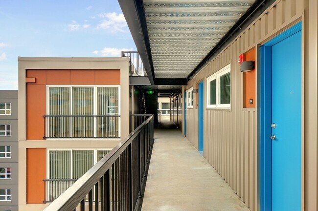 Building Photo - Stylish Urban Living with Sustainable Comf...