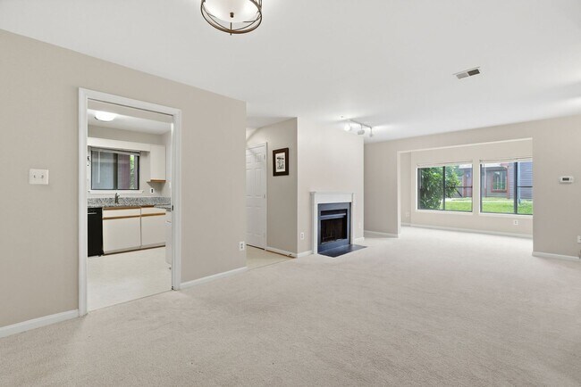 Building Photo - Contemporary design meets exceptional space in this inviting ground level residence, offering eff...