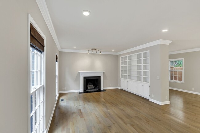 Spacious Den with gas fireplace and built-in bookcase. - 153B Woodmont Blvd