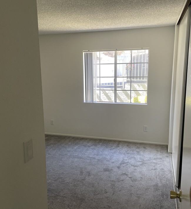 Master Bedroom entry with new carpet and full wall sliding closet doors - 18071 Beneda Ln