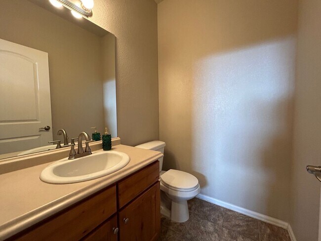 Building Photo - $500 Off First Month Of Rent! Modern 3BR Townhome with Fenced Yard & Garage