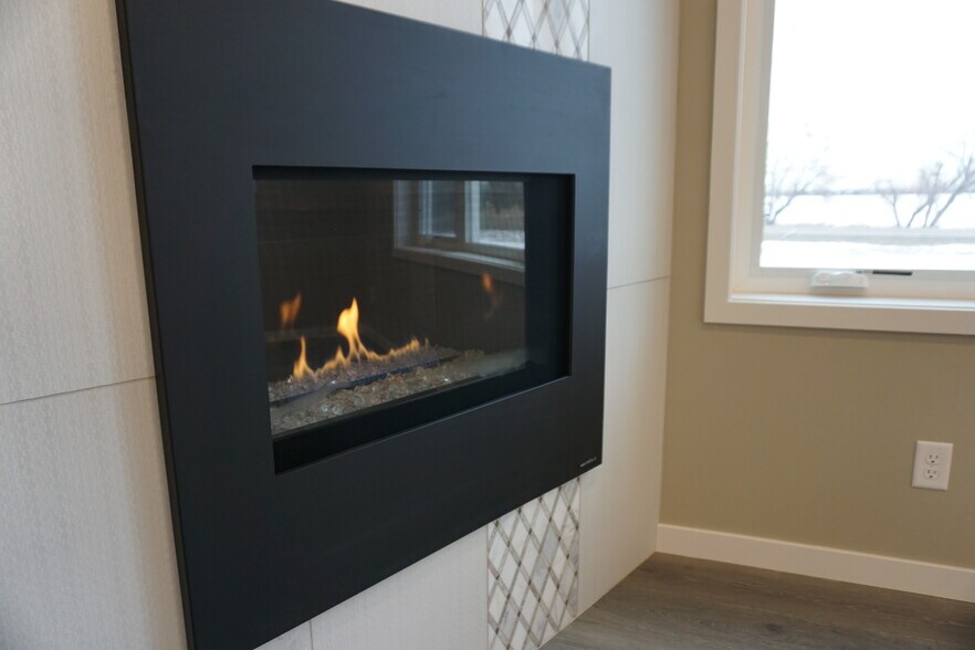 A great fireplace for cooler days (Photos are of similar unit with similar finishes.) - 3811 Stacy Drive