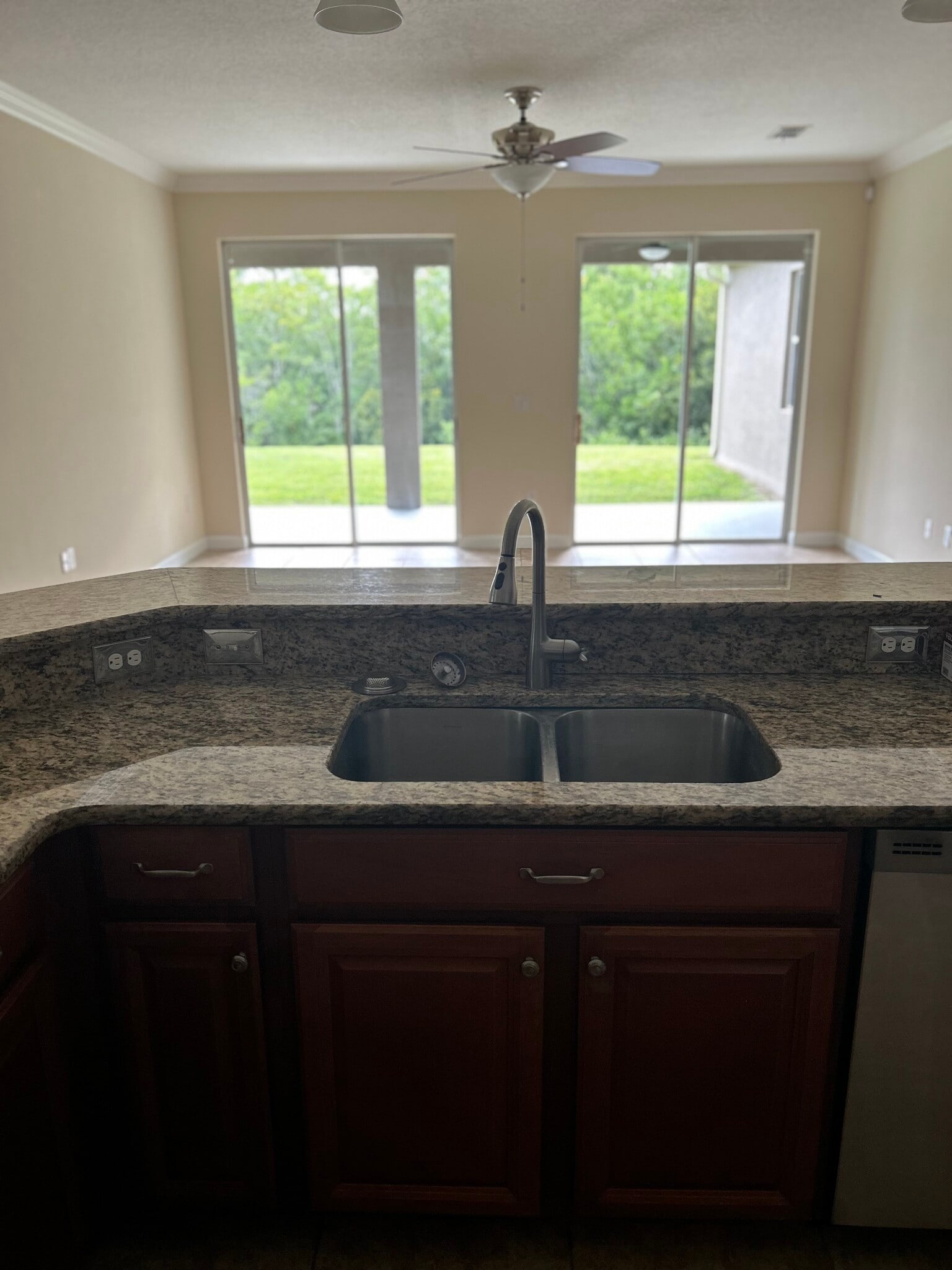 Kitchen view of living room - 6024 Sunset Isle Dr