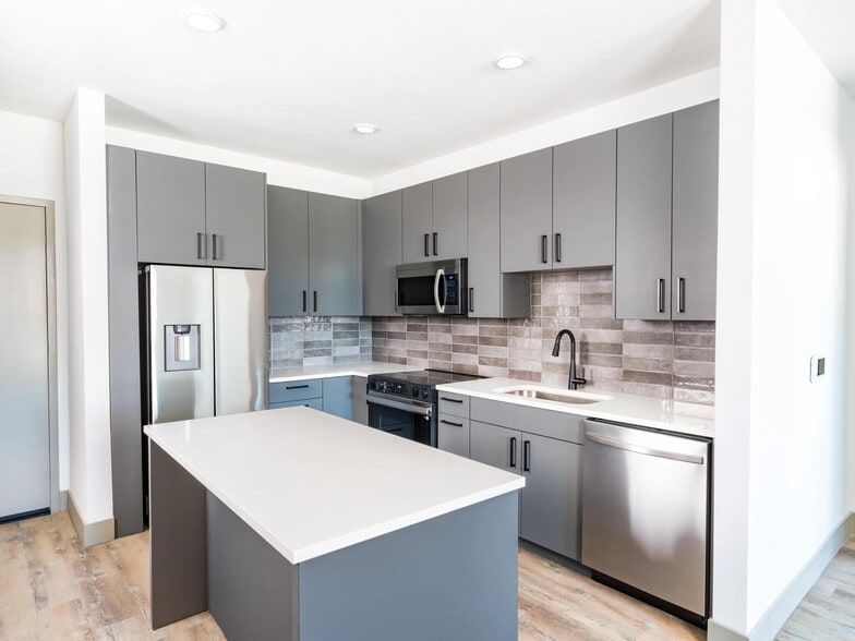 Modera Chandler features modern kitchens with multiple finish options, sleek cabinetry, and a functional island for everyday living. - Modera Chandler