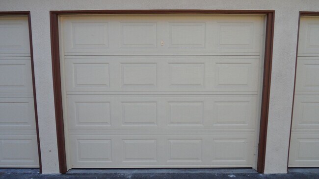 Building Photo - REMODELED 2BR; 1BA end unit condo w/ 1 car garage & 1 parking space