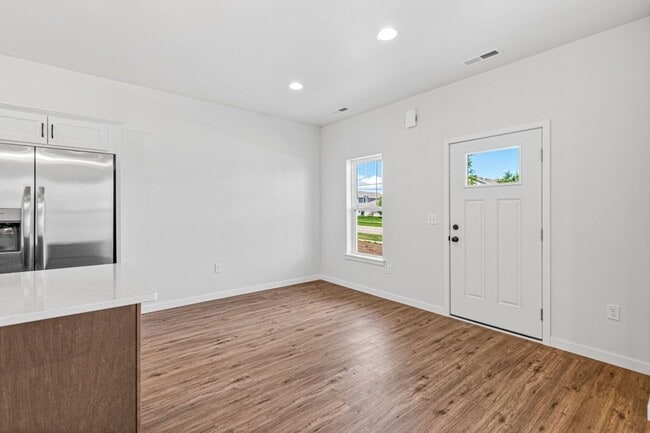 Building Photo - New 3 Bed Townhome with Covered Deck and Oversized Garage!