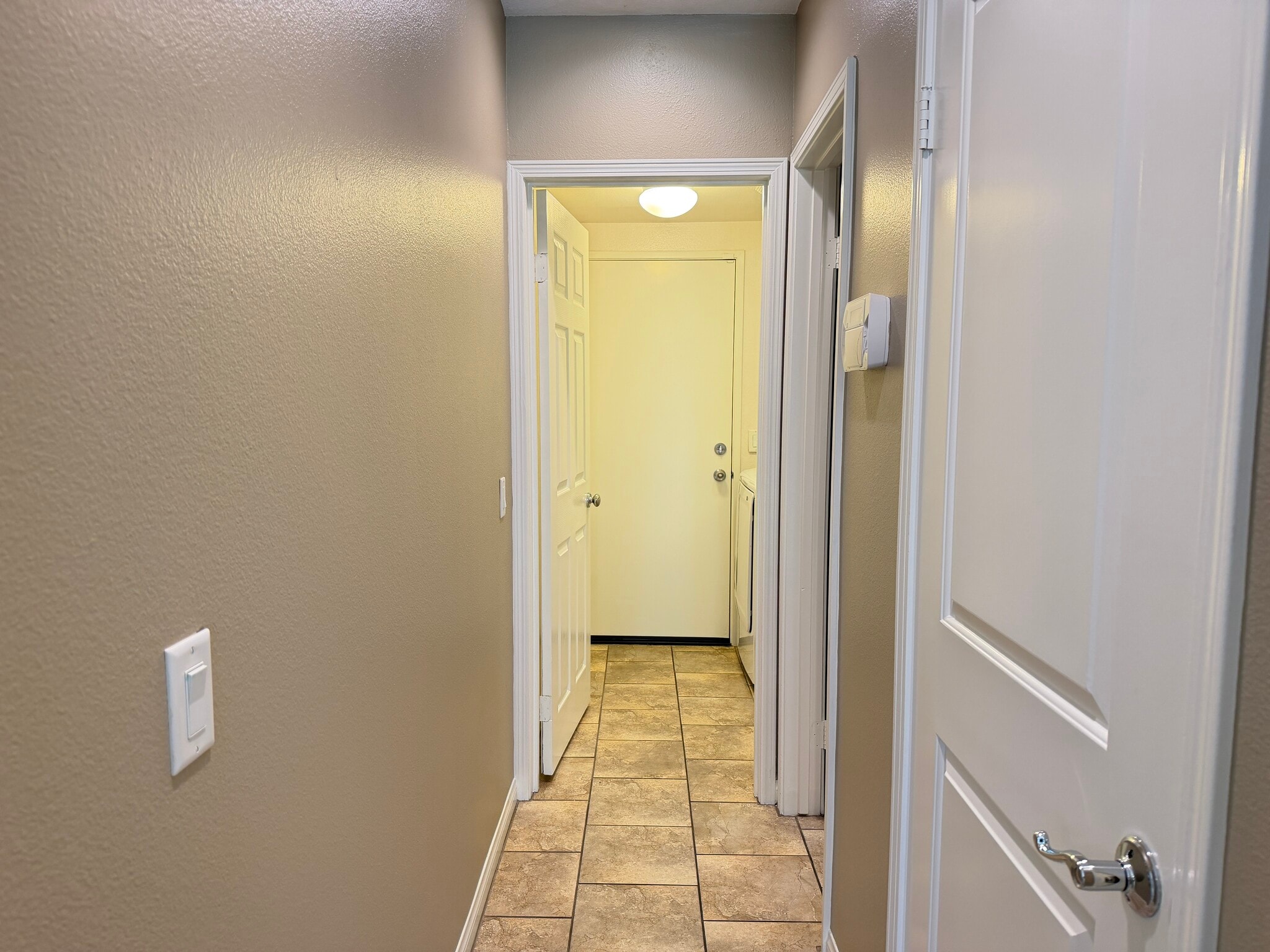 Hallway to laundry room and garage - 28377 Mirabelle Ln