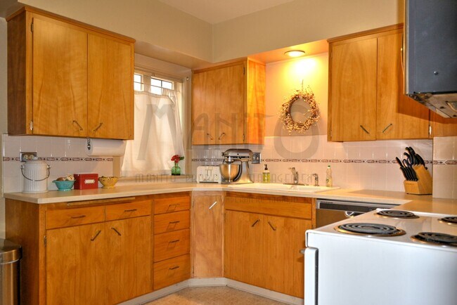 Building Photo - **COMING SOON** Beautiful Down River Brick Bungalow with River Views