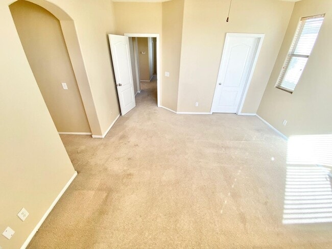 Building Photo - THIS SPACIOUS RESIDENCE FEATURES 4 BEDROOM...