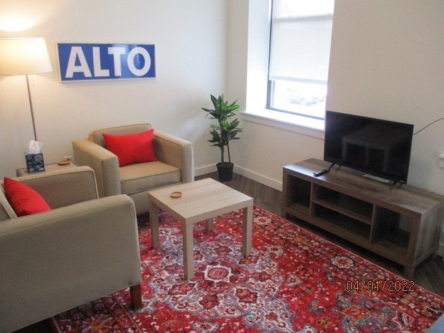 Living area includes sofa, side chair, and TV - 818 12th St
