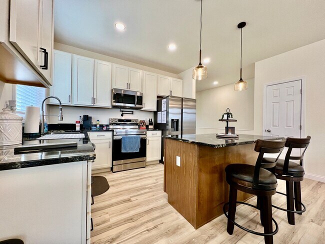 Building Photo - Beautiful NEW Ranch Home with a large deck & games