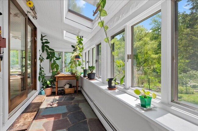 Building Photo - Stunning Updated Home with Private Pond Views in Chappaqua