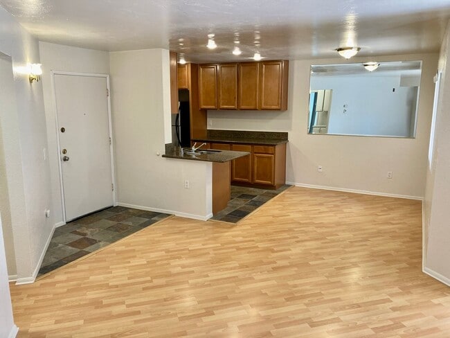 Building Photo - One Bedroom with Garage and IN-Unit laundry in Resort-Style Complex