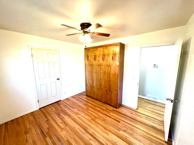 Bedroom 1 with included Murphy bed. Works great as guest room or office. - 3096 S Marie Cir