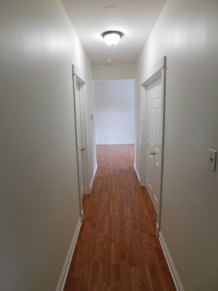 Hallway. New flooring being installed. - 1566 Dewey Ave