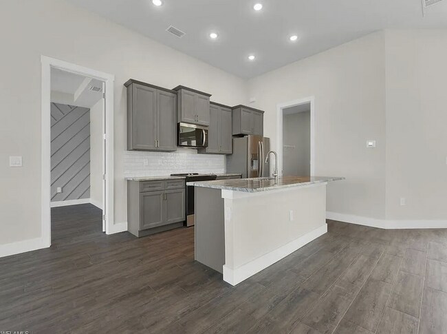 Building Photo - Almost New Construction Waterfront Home in NE Cape Featuring A Pool, Fenced Yard & More! COMING SOON