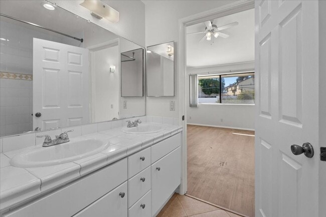 Building Photo - Light Filled Townhome Style Condo with Private Patios and Direct Access