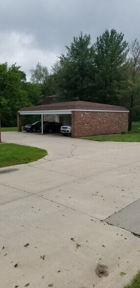 Covered parking with storage closet - 813 E Franklin St