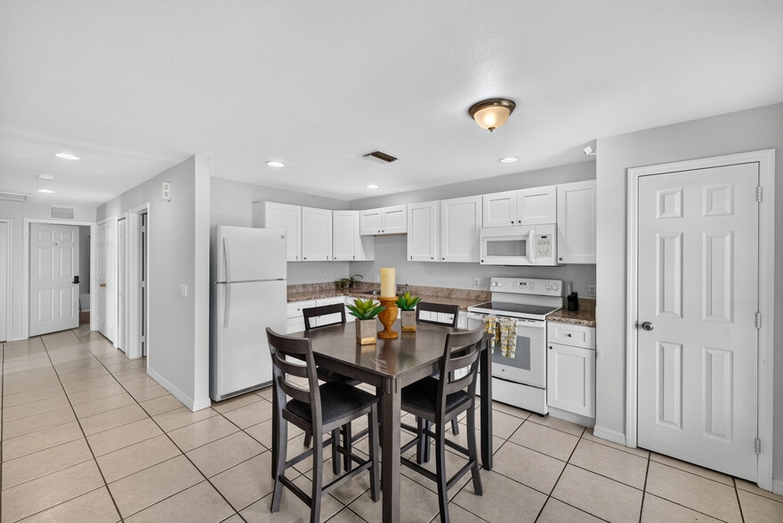 Fully-Equipped Kitchen with white, shaker-style cabinets, refrigerator, oven range & microwave - 217 Ichabod Ave