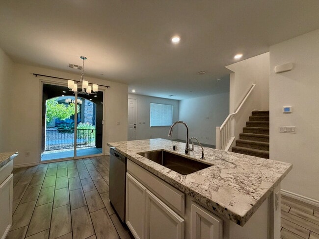 Building Photo - GATED 3 BED 2.5 BATH TOWNHOME WITH 2-CAR GARAGE, COVERED PATIO & COMMUNITY POOL