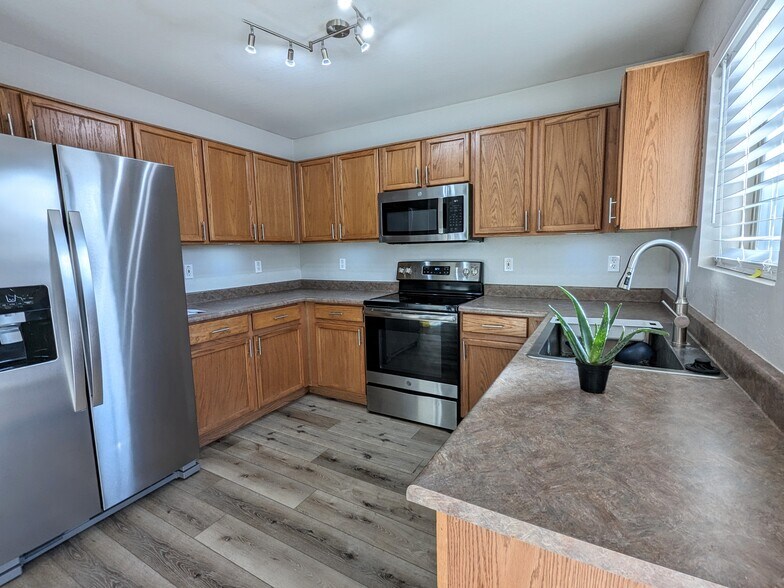 Large kitchen with matching stainless steel appliances - 11813 W Maui Ln