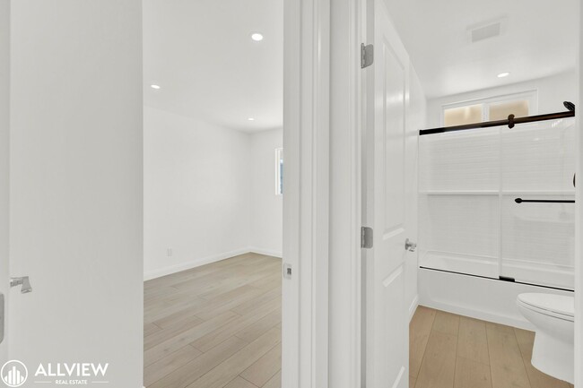 Building Photo - Fully Renovated 4-Bedroom Home with Firepl...