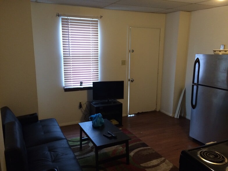 Living room with high-def tv, and sleeper sofa. - 539 Blaine Avenue