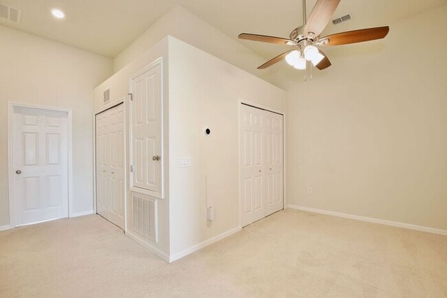 Building Photo - Immaculate Townhome · Dual En-Suite Bedrooms + Flex Loft · Cable & Internet Included · 3.5 Miles ...