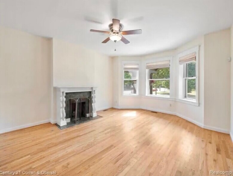 Living Room w/ Bay Windows & Fireplace! - 455 E Ferry St
