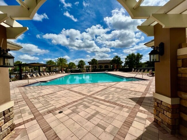 Building Photo - EAGLE CREEK LAKE NONA! WELCOME HOME! Beautiful water views! Spacious 2 story-3 bedroom 2.5 bath h...