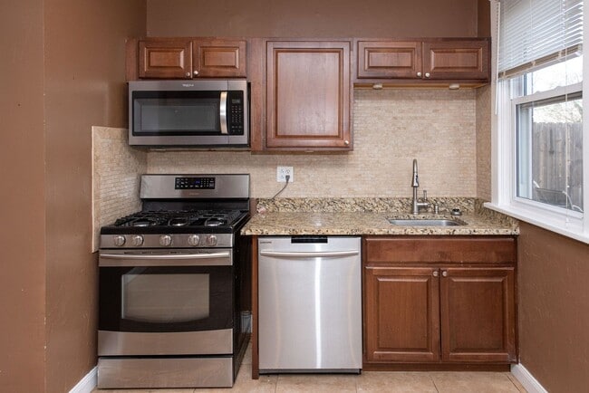 Building Photo - NORWOOD-  UNIT #1, 2+ bedroom 1.5 BATH W/ GARAGE /OVERSIZED YARD/DECK