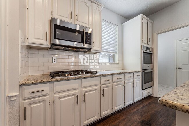 Building Photo - Recently Updated Plano Property with Modern Features and Serene Surroundings