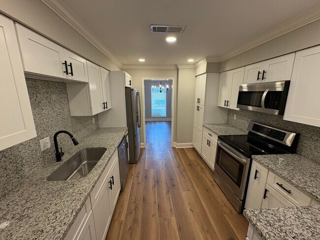 Building Photo - Totally redone 4 bedrooms townhouse.