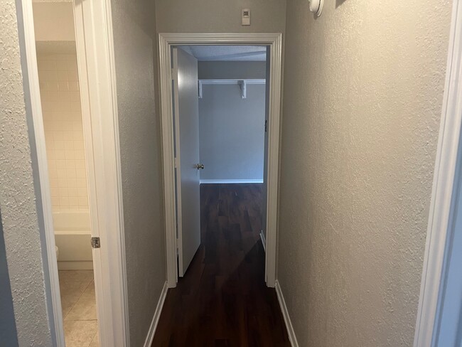 Hallway to guest bath and bed 3 - 2213 Oak Bluff Dr