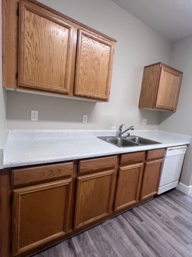 Building Photo - Three bedroom townhouse with 2 car garage